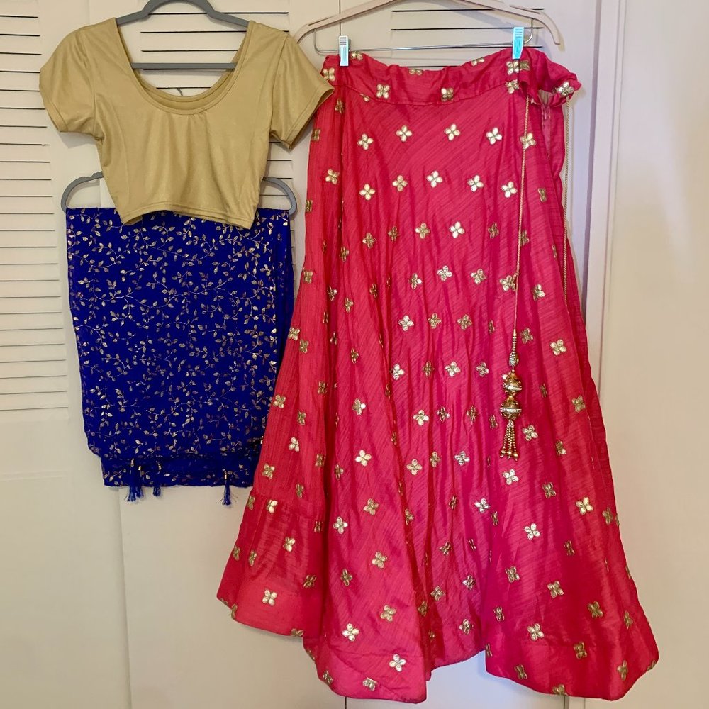Pink and gold lehenga choli with blue scarf
